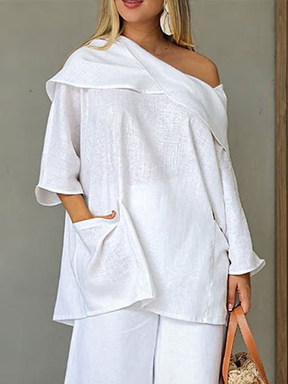 Dametopp med uregelmessig krage