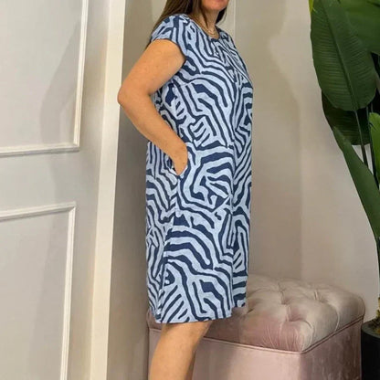 🌸 Sommerlig bohemsk blomsterkjole med rund utringning